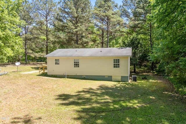 145 Mark St, Franklinton, NC 27525 - back of property featuring a lawn, central air condition unit, and crawl space