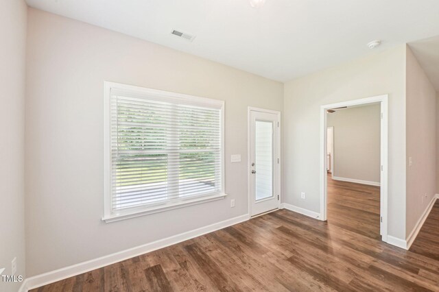entryway featuring wood finished floors and baseboards