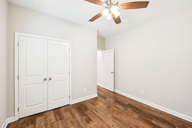 unfurnished bedroom with wood finished floors, baseboards, a closet, and ceiling fan