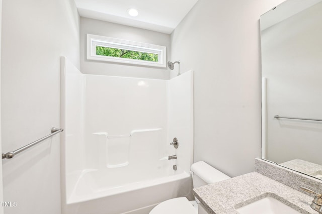 full bathroom with toilet, vanity, and shower / tub combination
