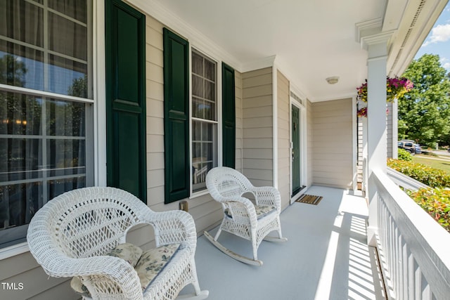 balcony featuring a porch