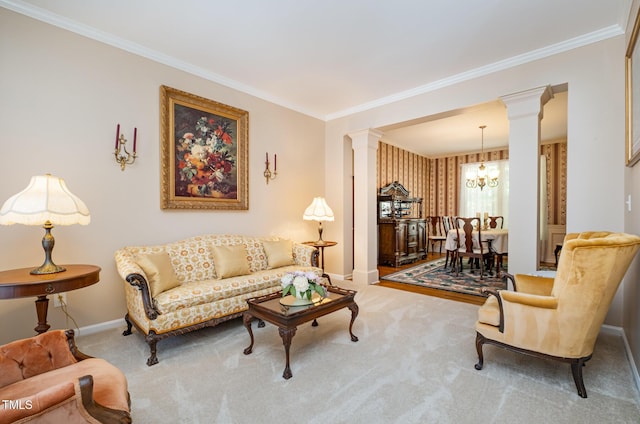 carpeted living room featuring decorative columns, crown molding, a chandelier, and baseboards