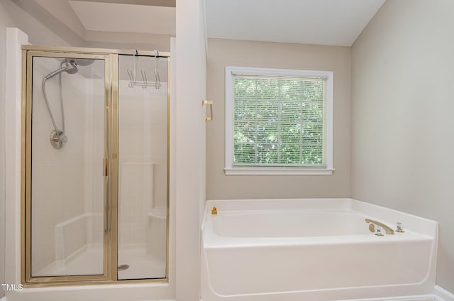 full bath featuring a shower stall and a bath