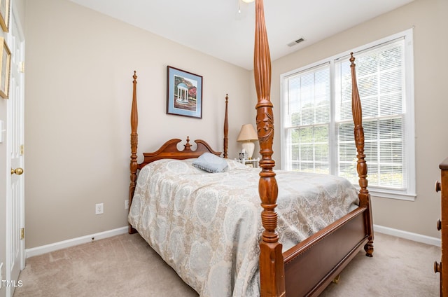 bedroom with carpet flooring and baseboards