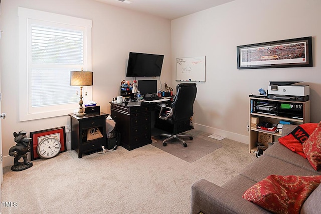home office featuring baseboards and carpet