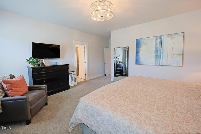 bedroom with baseboards, carpet flooring, and a notable chandelier