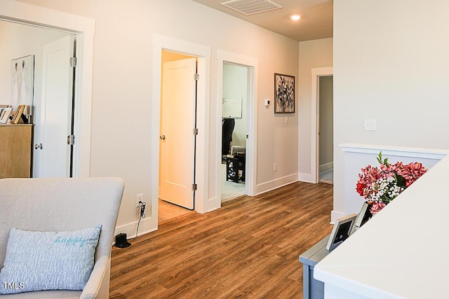 sitting room with visible vents, recessed lighting, baseboards, and wood finished floors