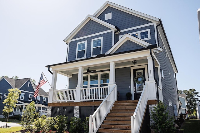 view of front of home with a ceiling fan and covered porch