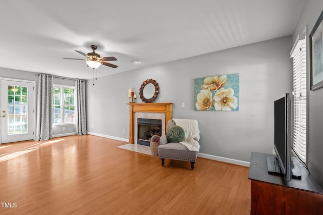 612 Lakeview Ave, Wake Forest, NC 27587 - living area with baseboards, a fireplace, a ceiling fan, and light wood finished floors