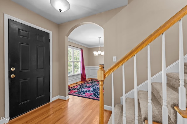 612 Lakeview Ave, Wake Forest, NC 27587 - foyer entrance with arched walkways, ornamental molding, stairs, and wood finished floors