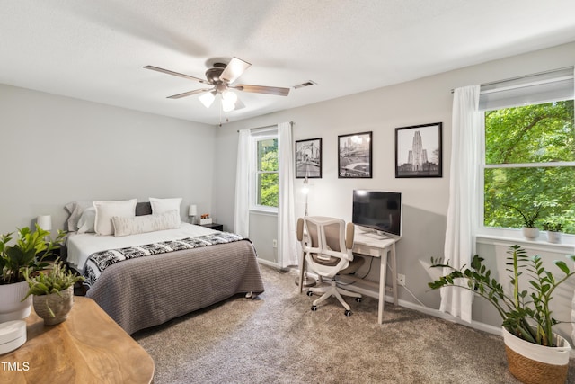 bedroom with carpet flooring, baseboards, visible vents, and ceiling fan