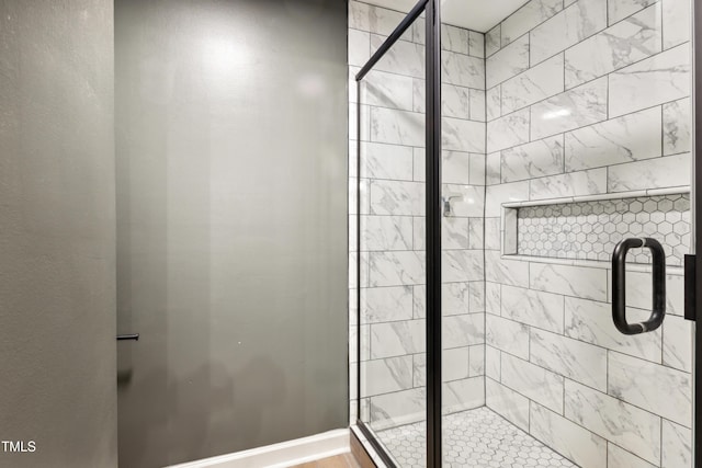 bathroom with a shower stall