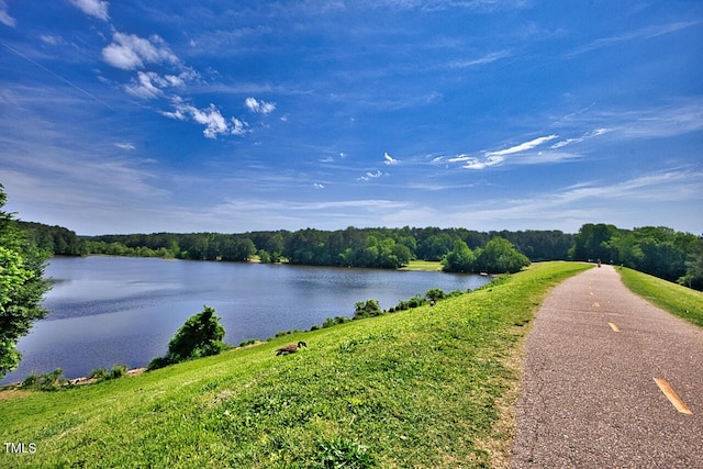 property view of water featuring a forest view