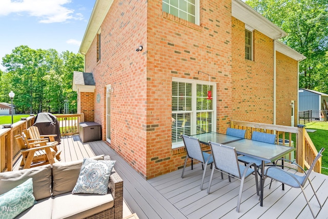 deck with outdoor dining area and central AC
