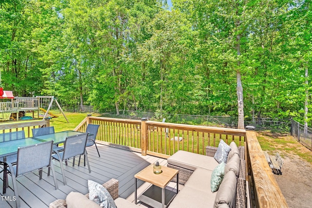deck featuring a fenced backyard, a lawn, outdoor dining space, and an outdoor living space
