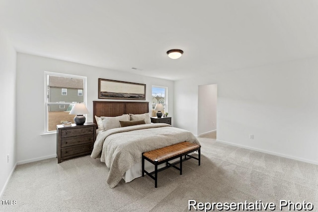 carpeted bedroom with baseboards