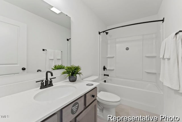 bathroom featuring vanity, tile patterned floors, washtub / shower combination, and toilet