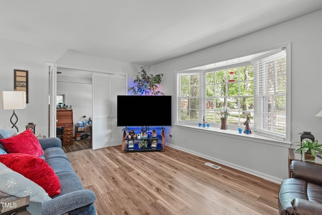living room with wood finished floors and baseboards