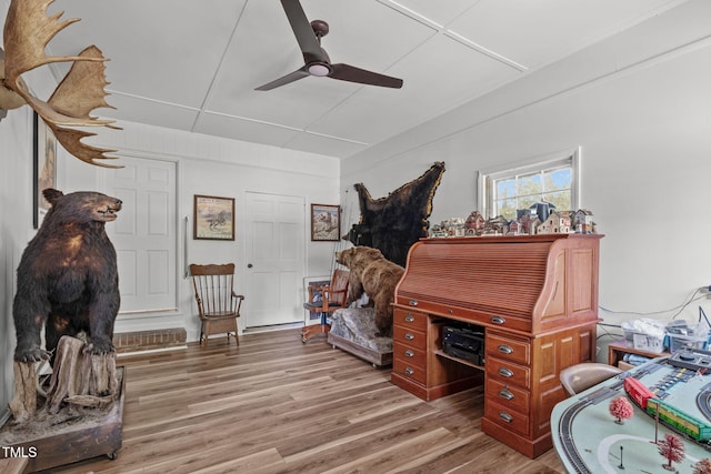 office space featuring ceiling fan and wood finished floors