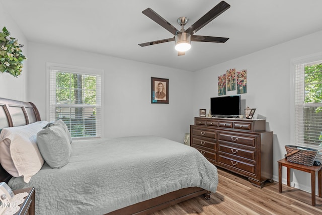 bedroom with light wood-style flooring and ceiling fan