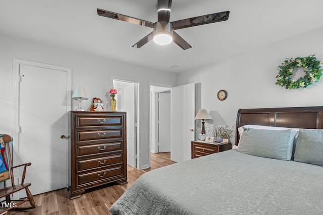 bedroom with light wood finished floors and ceiling fan