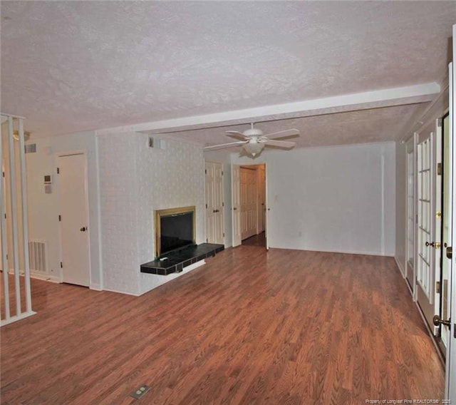 161 Lakeview Dr, Southern Pines, NC 28387 - unfurnished living room featuring a textured ceiling, ceiling fan, wood finished floors, and a fireplace