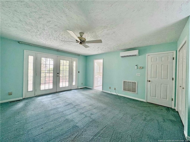 161 Lakeview Dr, Southern Pines, NC 28387 - empty room featuring french doors, a ceiling fan, a textured ceiling, visible vents, and a wall mounted AC