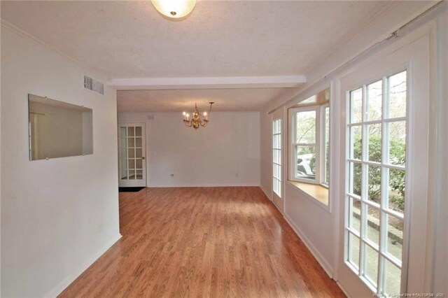 161 Lakeview Dr, Southern Pines, NC 28387 - spare room with an inviting chandelier, baseboards, and light wood-type flooring