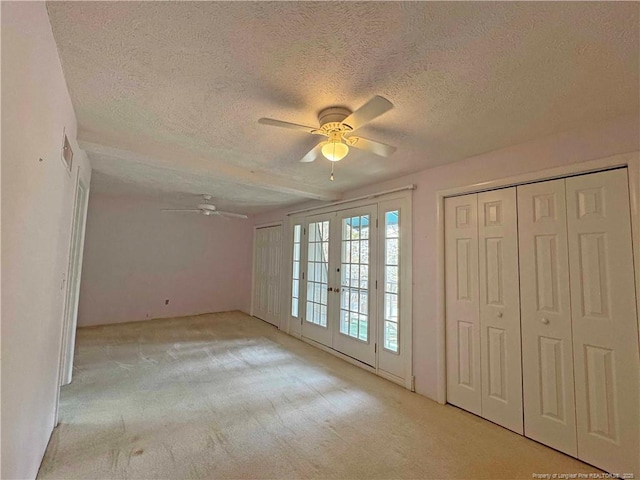 161 Lakeview Dr, Southern Pines, NC 28387 - unfurnished bedroom with light colored carpet, a textured ceiling, and ceiling fan