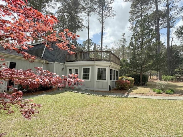 161 Lakeview Dr, Southern Pines, NC 28387 - back of house featuring a shingled roof, a yard, and a balcony