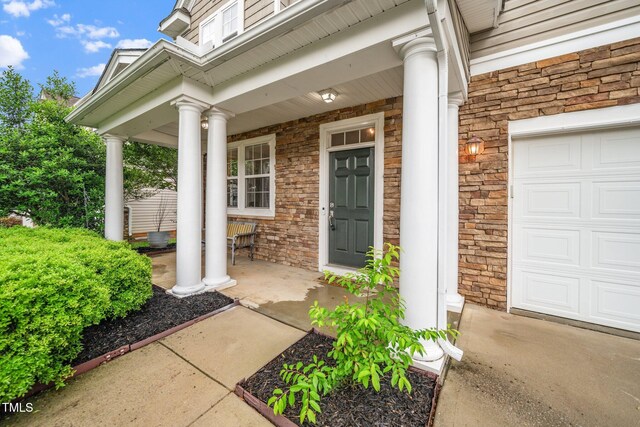 149 Cinder Cross Way, Garner, NC 27529 - view of exterior entry featuring a porch and stone siding