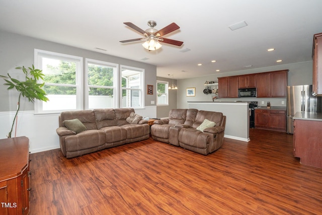 149 Cinder Cross Way, Garner, NC 27529 - living area featuring dark wood finished floors, ceiling fan, recessed lighting, and baseboards