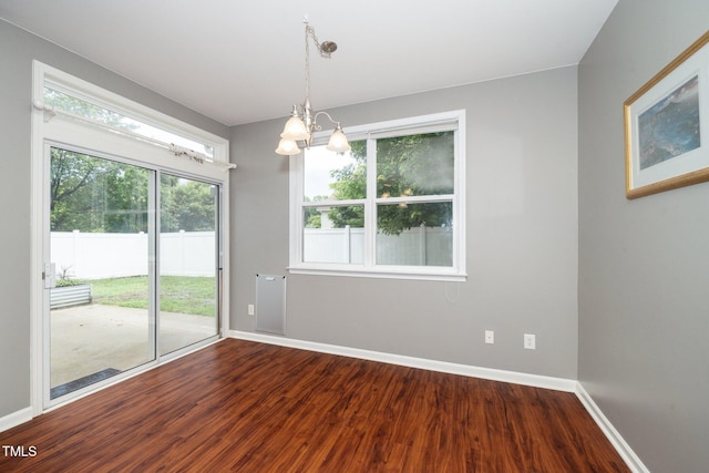 149 Cinder Cross Way, Garner, NC 27529 - unfurnished room with dark wood finished floors, a chandelier, and baseboards