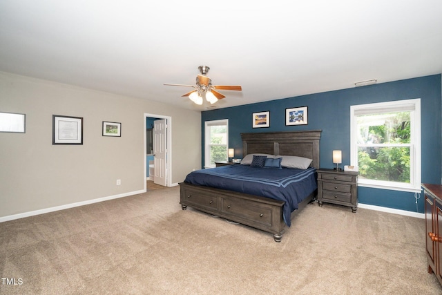 149 Cinder Cross Way, Garner, NC 27529 - bedroom featuring light colored carpet, baseboards, multiple windows, and ceiling fan