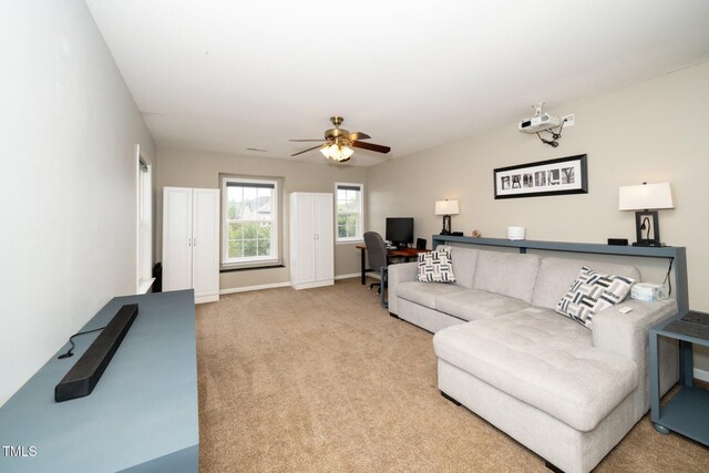 149 Cinder Cross Way, Garner, NC 27529 - living room featuring ceiling fan, carpet, a desk, and baseboards