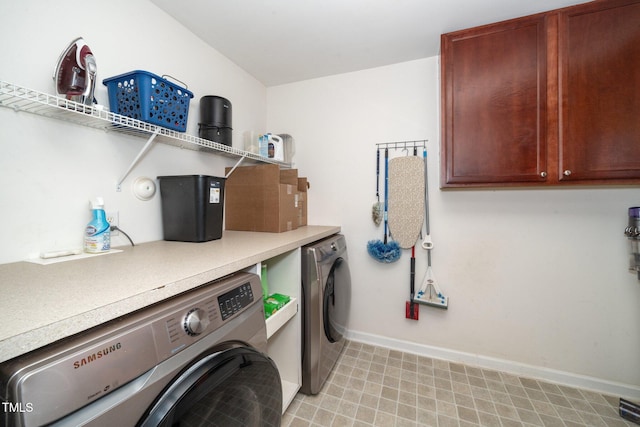 149 Cinder Cross Way, Garner, NC 27529 - laundry area with washing machine and clothes dryer, baseboards, and cabinet space