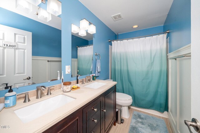 149 Cinder Cross Way, Garner, NC 27529 - full bath with toilet, double vanity, and a shower with curtain