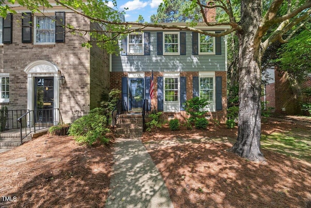 3025 Wycliff Rd, Raleigh, NC 27607 - view of front facade featuring brick siding and a chimney