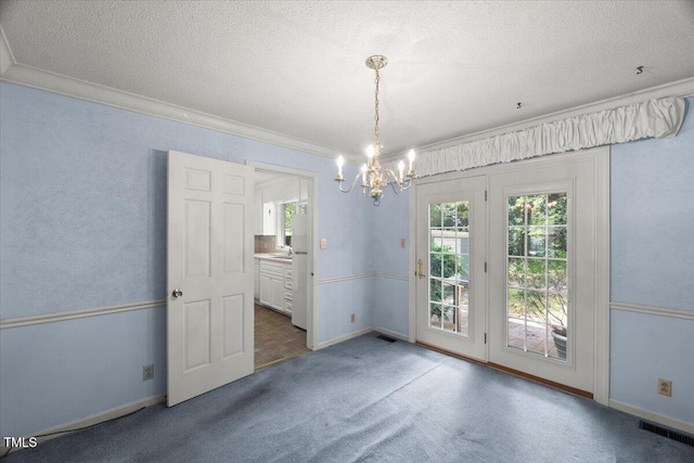 3025 Wycliff Rd, Raleigh, NC 27607 - unfurnished room with a chandelier, carpet floors, ornamental molding, a textured ceiling, and baseboards