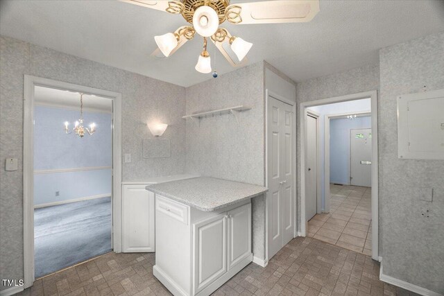 3025 Wycliff Rd, Raleigh, NC 27607 - kitchen with ceiling fan, light countertops, a chandelier, electric panel, and open shelves