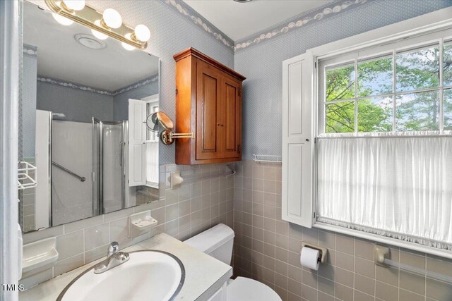 3025 Wycliff Rd, Raleigh, NC 27607 - bathroom with vanity, toilet, wallpapered walls, a shower, and tile walls