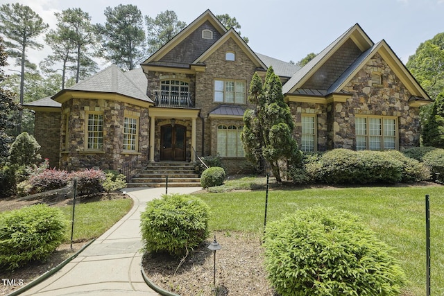 5901 Charleycote Dr, Raleigh, NC 27614 - view of front of property featuring a standing seam roof, stone siding, and a front lawn