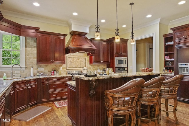 5901 Charleycote Dr, Raleigh, NC 27614 - kitchen featuring a sink, premium range hood, stainless steel appliances, reddish brown cabinets, and dark wood-style floors