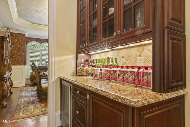5901 Charleycote Dr, Raleigh, NC 27614 - bar featuring crown molding, wood finished floors, tasteful backsplash, wine cooler, and a bar