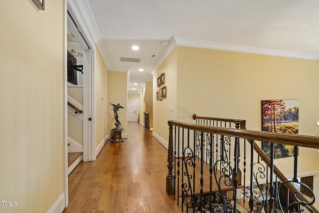 5901 Charleycote Dr, Raleigh, NC 27614 - hallway with crown molding, recessed lighting, visible vents, and wood finished floors