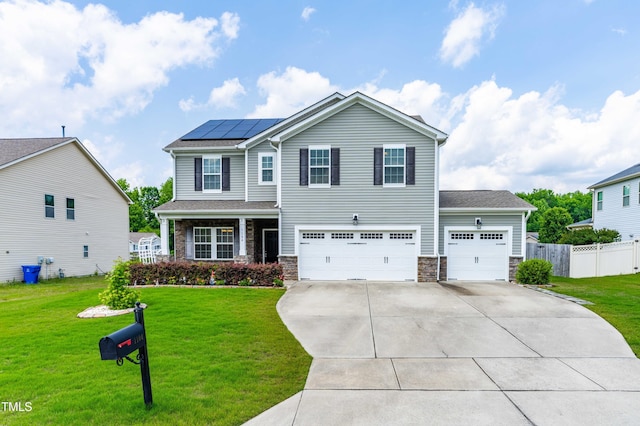 1104 Arden Trace Ct, Fuquay Varina, NC 27526 - craftsman-style house with driveway, roof mounted solar panels, stone siding, an attached garage, and a garage