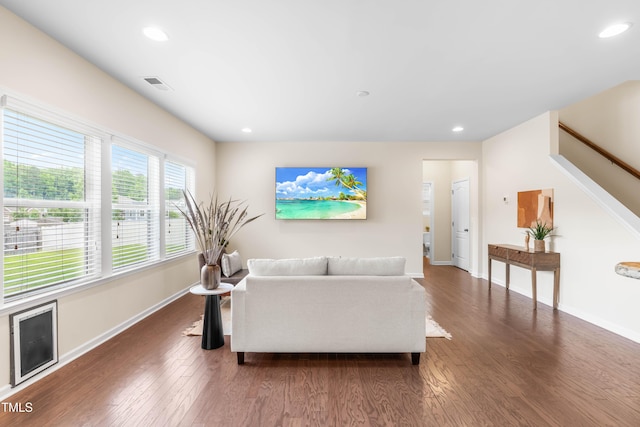 1104 Arden Trace Ct, Fuquay Varina, NC 27526 - living area featuring wood finished floors, baseboards, stairway, and recessed lighting