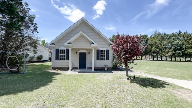 bungalow-style home with a front lawn