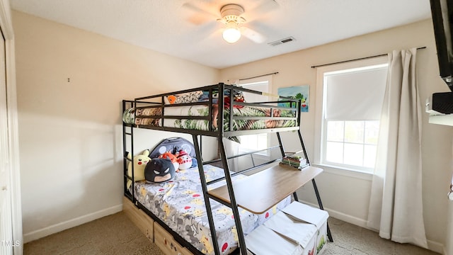 bedroom featuring carpet floors, baseboards, visible vents, and multiple windows