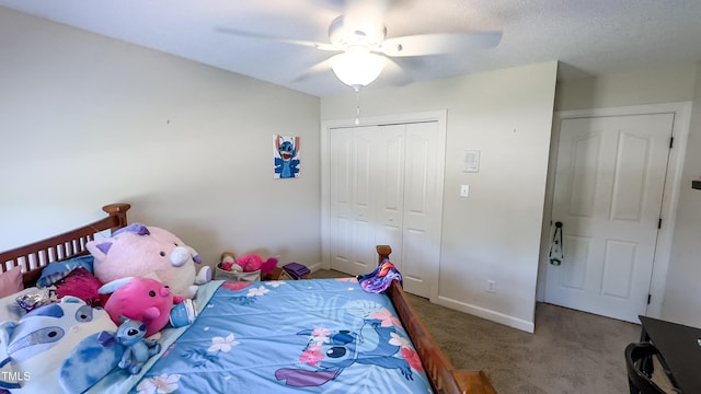 bedroom with baseboards, a ceiling fan, a closet, and carpet flooring